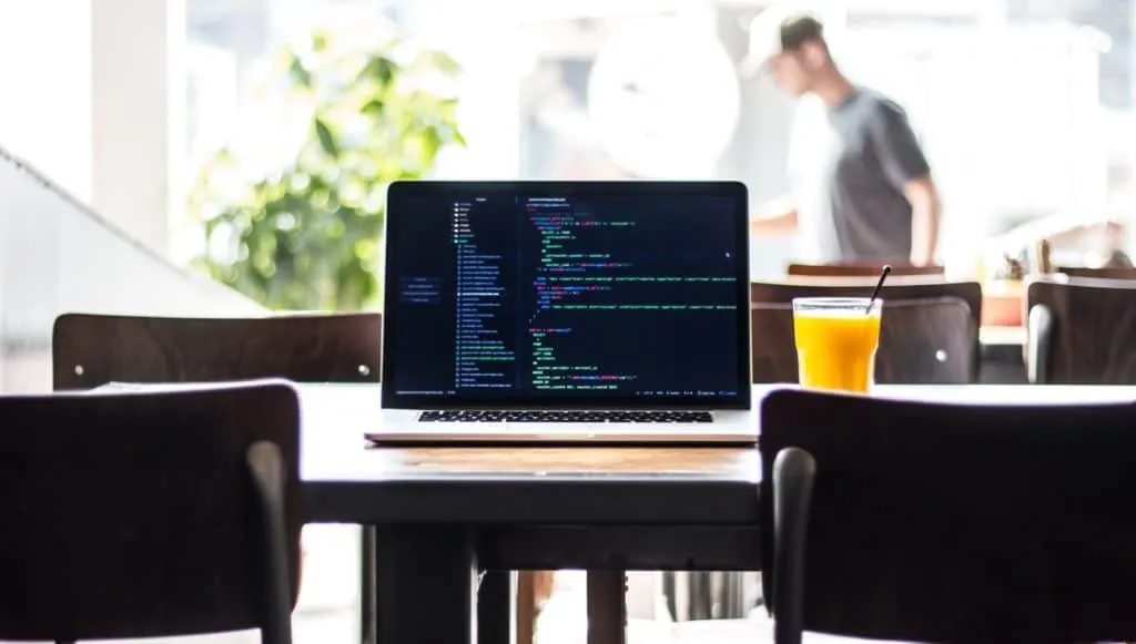 Laptop with code on its screen — still the most powerful, versatile computing device